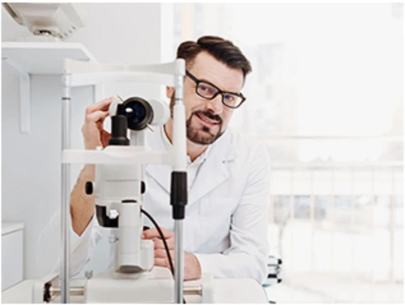 Optometrist Using Slit Lamp Equipment At Villages Optical In The Villages, Fl&Quot;